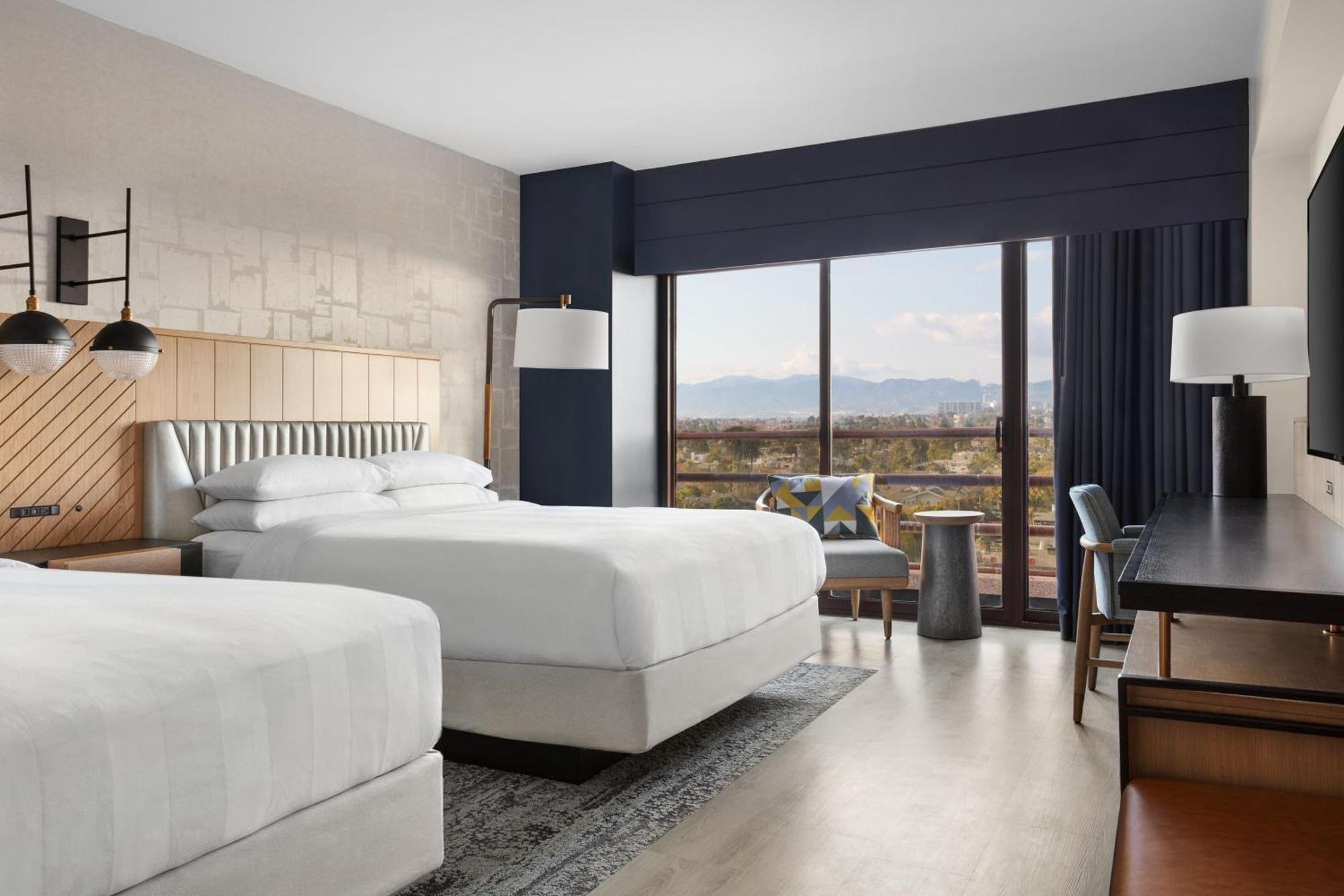 Guest Room with Two Double Beds and City View